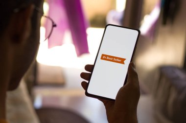 West Bangal, India - December 05, 2021 : Amazon Best seller logo on phone screen stock image.