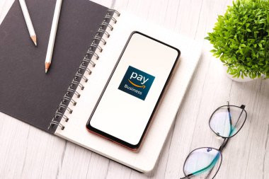 West Bangal, India - December 05, 2021 : Amazon business logo on phone screen stock image.