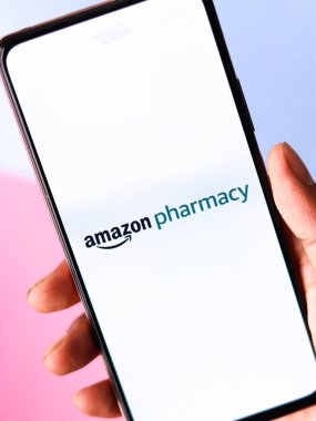 West Bangal, India - December 05, 2021 : Amazon Pharmacy logo on phone screen stock image.