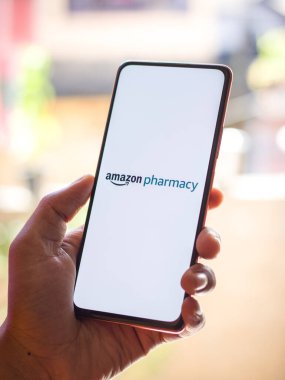 West Bangal, India - December 05, 2021 : Amazon Pharmacy logo on phone screen stock image.