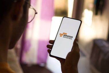 West Bangal, India - December 05, 2021 : Amazon Web Services logo on phone screen stock image.