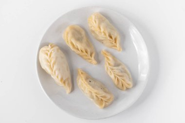 Traditional Dumpling Momos Served on white plate.