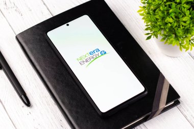 West Bangal, India - April 20, 2022 : NextEra Energy logo on phone screen stock image.