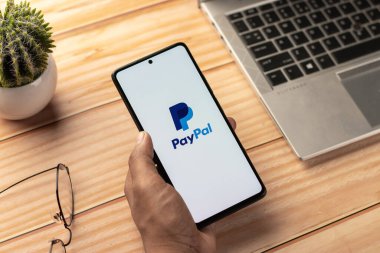 West Bangal, India - April 20, 2022 : PayPal logo on phone screen stock image.