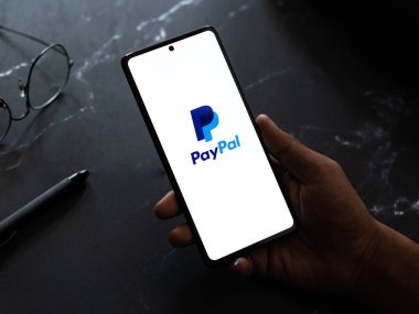 West Bangal, India - April 20, 2022 : PayPal logo on phone screen stock image.