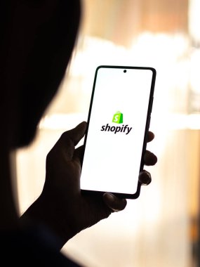 West Bangal, India - April 20, 2022 : Shopify on phone screen stock image.