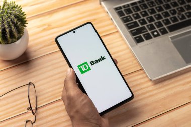 West Bangal, India - April 20, 2022 : TD Bank on phone screen stock image.