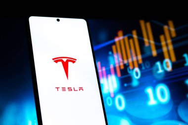 West Bangal, India - April 20, 2022 : Tesla on phone screen stock image.