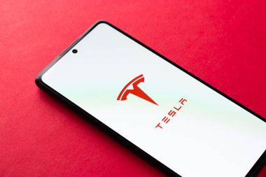 West Bangal, India - April 20, 2022 : Tesla on phone screen stock image.