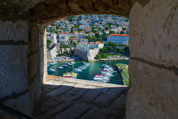 Beautiful picture of the small boats in the harbor just below the new neighborhoods of Dubrovnik
