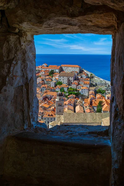 Coloful rooftops, the Bell Tower and the adriatic sea as viewed from a window in the Old Town's City wall