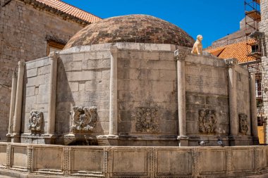 Kuak the guardian and protector sits atop one of the panels of Onofrios Fountain in Old Town Dubrovnik
