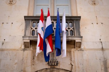 National flags adorn an administrative building in Old Town Dubrovnik