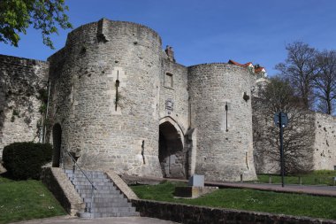 View of Port Gayole gate house and the medieval ramparts of Boulogne-sur-mer, in the Pas de Calais region of northern France. Sunny spring day with blue sky. clipart
