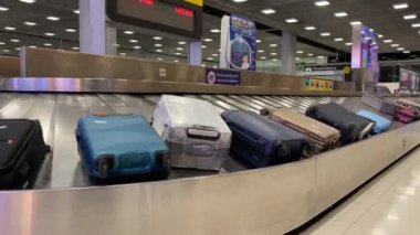 Baggage moving on belt at the airport.