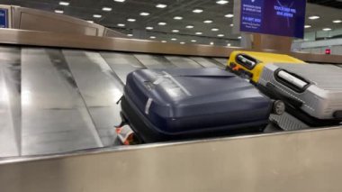 Baggage moving on belt at the airport.