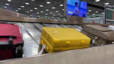 Baggage moving on belt at the airport.