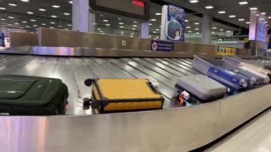 Baggage moving on belt at the airport.