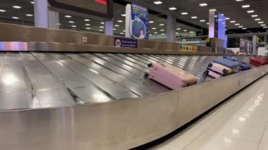 Baggage moving on belt at the airport.