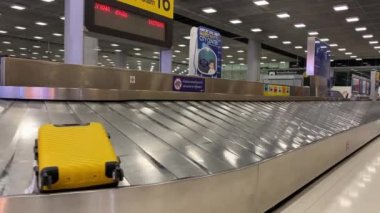 Baggage moving on belt at the airport.