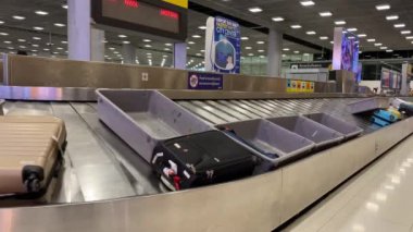 Baggage moving on belt at the airport.