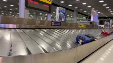 Baggage moving on belt at the airport.