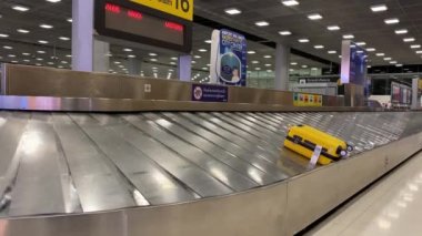 Baggage moving on belt at the airport.