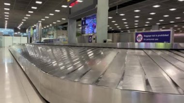 Baggage moving on belt at the airport.