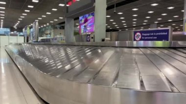 Baggage moving on belt at the airport.