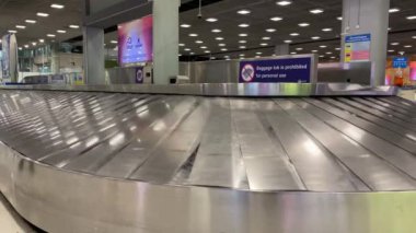 Baggage moving on belt at the airport.