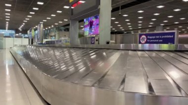 Baggage moving on belt at the airport.