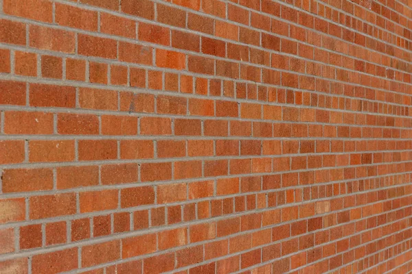 用普通粘合砖做的厚重的老式砖墙的完整框架抽象背景 砖的色调各异 有橙色和红色的 有淡淡的光泽 — 图库照片