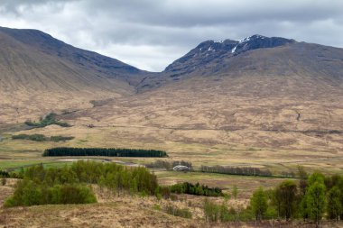 Scenic landscape view of the Scottish highlands in the western part of Scotland, with overcast sky
