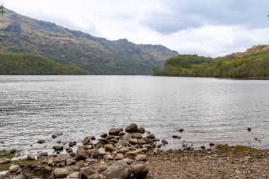 Scenic landscape view of the rocky shore of Loch Lomond in Scotland