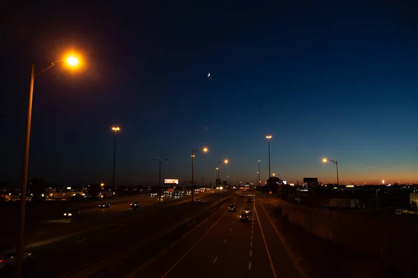 Long Exposure Shot Busy Traffic Highway Moon Blue Orange Sunset — Stock Fotó