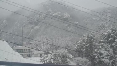 Snowfall in mountains in Nagano, Japan.