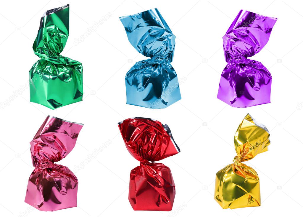 Chocolate candies in a colorful wrapper on a white background. Set of wrapped candies.