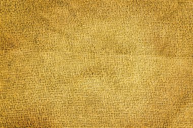 Metin veya iç tasarım için arkaplan olarak soyut kumaş dokusunun yakın plan görüntüsü. Kahverengi yapay kumaş dokusu.  