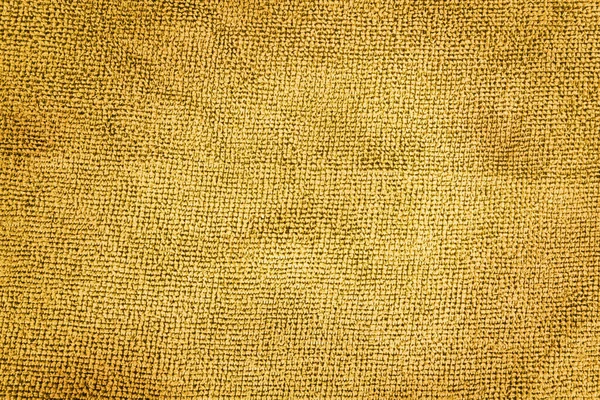 Metin veya iç tasarım için arkaplan olarak soyut kumaş dokusunun yakın plan görüntüsü. Kahverengi yapay kumaş dokusu.  