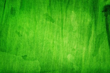 Texture of green natural fabric. St Patricks Day abstract wallpaper. 