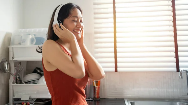 Woman Listening Music Headphones Kitchen Home Lifestyles Concepts — Foto de Stock