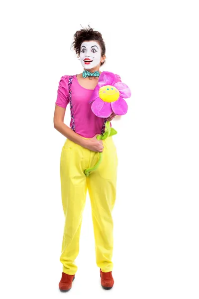 Mädchen Clown halten Blume — Stockfoto