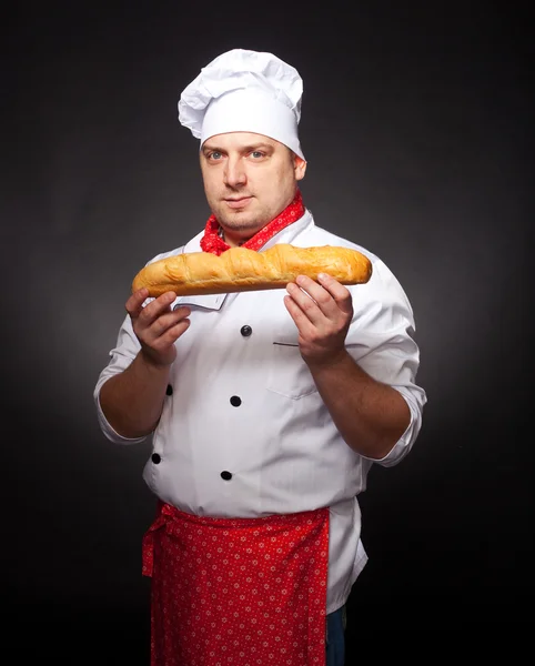 Baker with bread — Stock Photo, Image