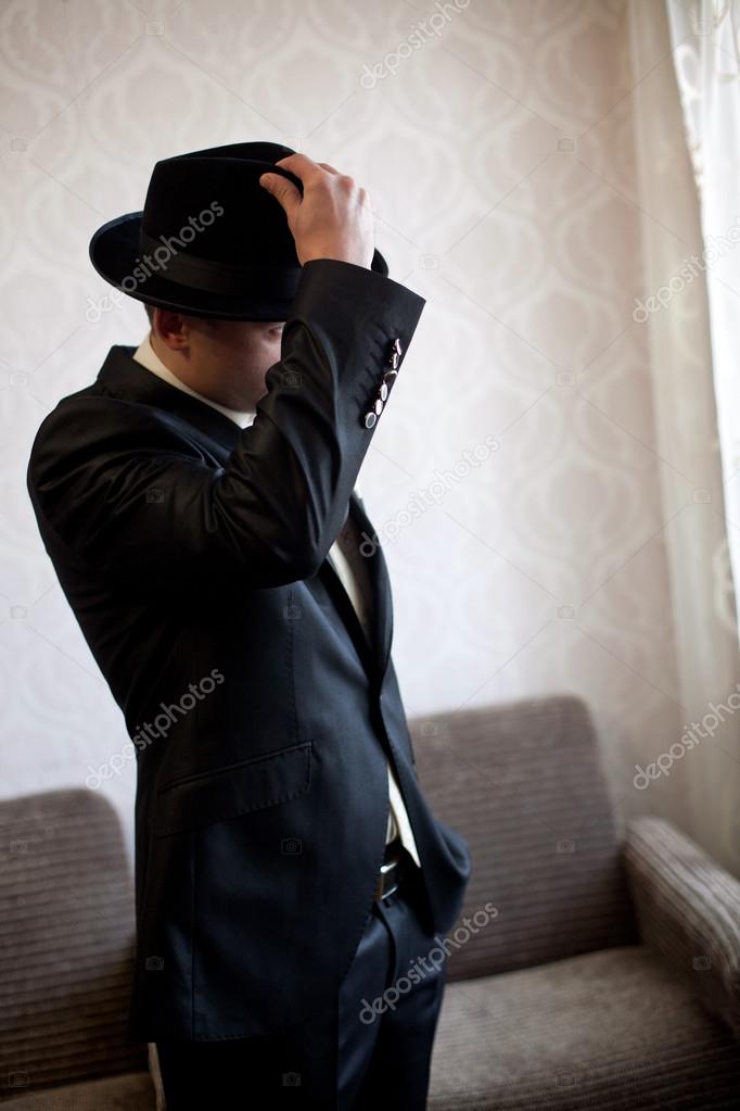 Man in black hat Stock Photo by ©vasyashepella 40784933