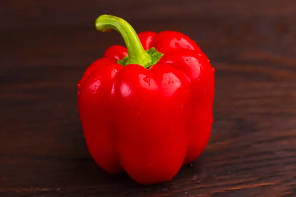 Pepper on wooden background — Stock Photo, Image