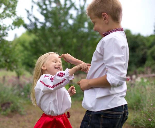 Broter and his little sister point — Stock Photo, Image