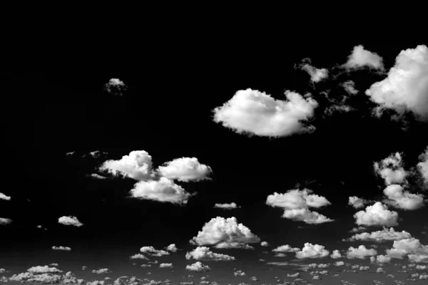 Real clouds and sky hi-res texture for design and retouch - abstract photo texture of the real clouds on the black background for adding and editing as a background layer in the Screen blending mode