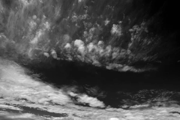 Real clouds and sky hi-res texture for design and retouch - abstract photo texture of the real clouds on the black background for adding and editing as a layer in the Screen mode