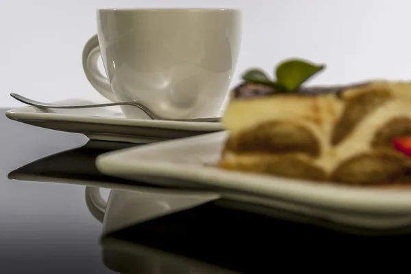 Tiramisu on black reflex background — Stock Photo, Image