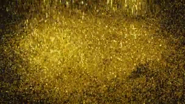 ゴールドダスト シマーは黒い背景に落ち 丘を形成します — ストック動画